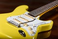 Yellow electric guitar with tremolo