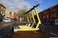 Yellow electric scooters in English town