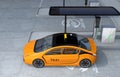 Yellow electric taxi charging in charging station
