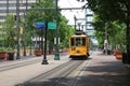 A yellow electric trolley on Main Street in downtown Memphis, Tennessee in summer Royalty Free Stock Photo