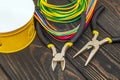 Yellow electrical junction box with cables wire and tools used in the electric installation process Royalty Free Stock Photo