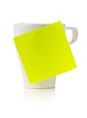 Yellow empty sticky note on white coffee or tea cup over white background Royalty Free Stock Photo