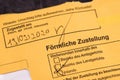 Yellow envelope with the text `Formal notification` in German, Germany Royalty Free Stock Photo