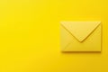 Yellow envelope on a vibrant yellow background, creating a monochrome and minimalistic composition. Royalty Free Stock Photo