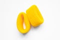 Yellow EPE fruit nets close-up isolated. Expanded polyethylene foam mesh for Fruit Wrap To prevent bumps. Royalty Free Stock Photo