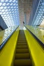 Yellow Escalator and blue roof Royalty Free Stock Photo