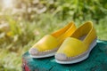 Yellow espadrilles in nature