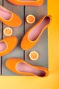 Yellow espadrilles shoes near slices of lemon