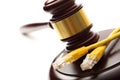 Yellow ethernet cable and gavel Royalty Free Stock Photo