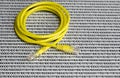 Yellow Ethernet cable on white background with binary code numbers Royalty Free Stock Photo