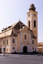 Yellow evangelical lutheran church with high clock tower in German style architecture