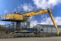 Yellow excavator Liebherr against the blue sky Royalty Free Stock Photo