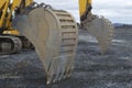 Yellow excavator construction site tractor heavy industry mechanical shovel closeup Royalty Free Stock Photo
