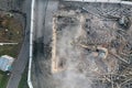 Yellow excavator destroys building. Heavy duty machine is demolishing a brick building. Demolition of the building . Demolition