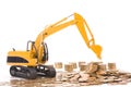 Yellow excavator digging a heap of coins