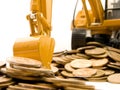 Yellow excavator digging a heap of coins Royalty Free Stock Photo