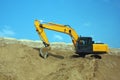 Yellow excavator, excavation work at a