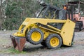 Yellow excavator in a grader parked Royalty Free Stock Photo