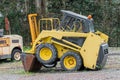 Yellow excavator in a grader parked Royalty Free Stock Photo