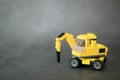 Yellow excavator hammer toy