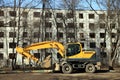 The yellow excavator on housebreaking Royalty Free Stock Photo