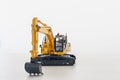Yellow Excavator loader model on  a white background Royalty Free Stock Photo