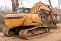 Yellow excavator for road repairing Royalty Free Stock Photo