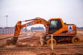 Yellow Excavator work at construction site