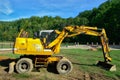 Yellow Excavator at Work