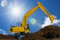 Yellow excavators are digging the soil in the construction site Royalty Free Stock Photo