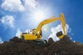 Yellow excavators are digging the soil in the construction site Royalty Free Stock Photo