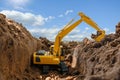 Yellow excavators are digging the soil in the construction site Royalty Free Stock Photo