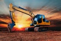 Yellow  Excavators are digging the soil in the construction site. Royalty Free Stock Photo