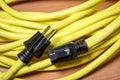 Yellow extension cord with black plugs