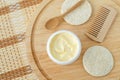 Yellow facial mask (banana face cream  shea butter hair mask  body butter) in the small white container. Royalty Free Stock Photo