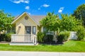 Yellow family house with small front yard