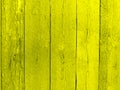 Yellow fence, yellow painted boards for backgrounds and textures. Royalty Free Stock Photo