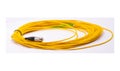 Yellow fiber optic cable rolled on white background, long network cable for data and internet connection Royalty Free Stock Photo