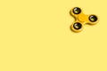 Yellow fidget spinner background template with copy space