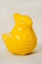 Yellow figurine made of clay, whistle toy bird