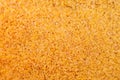 Yellow fine rice background, uncooked raw cereals, macro closeup Royalty Free Stock Photo