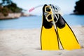 Yellow fins and snorkelling mask on beach in summer Royalty Free Stock Photo