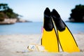 Yellow fins and snorkelling mask on beach in summer Royalty Free Stock Photo