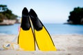 Yellow fins and snorkelling mask on beach in summer Royalty Free Stock Photo