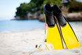 Yellow fins and snorkelling mask on beach in summer Royalty Free Stock Photo