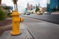 A yellow fire hydrant on road