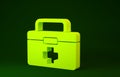 Yellow First aid kit icon isolated on green background. Medical box with cross. Medical equipment for emergency