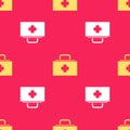 Yellow First aid kit icon isolated seamless pattern on red background. Medical box with cross. Medical equipment for