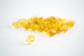 The yellow fish oil capsules, white background Royalty Free Stock Photo