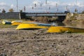 Yellow fishing boats lie on the sand by the river, Iran Royalty Free Stock Photo